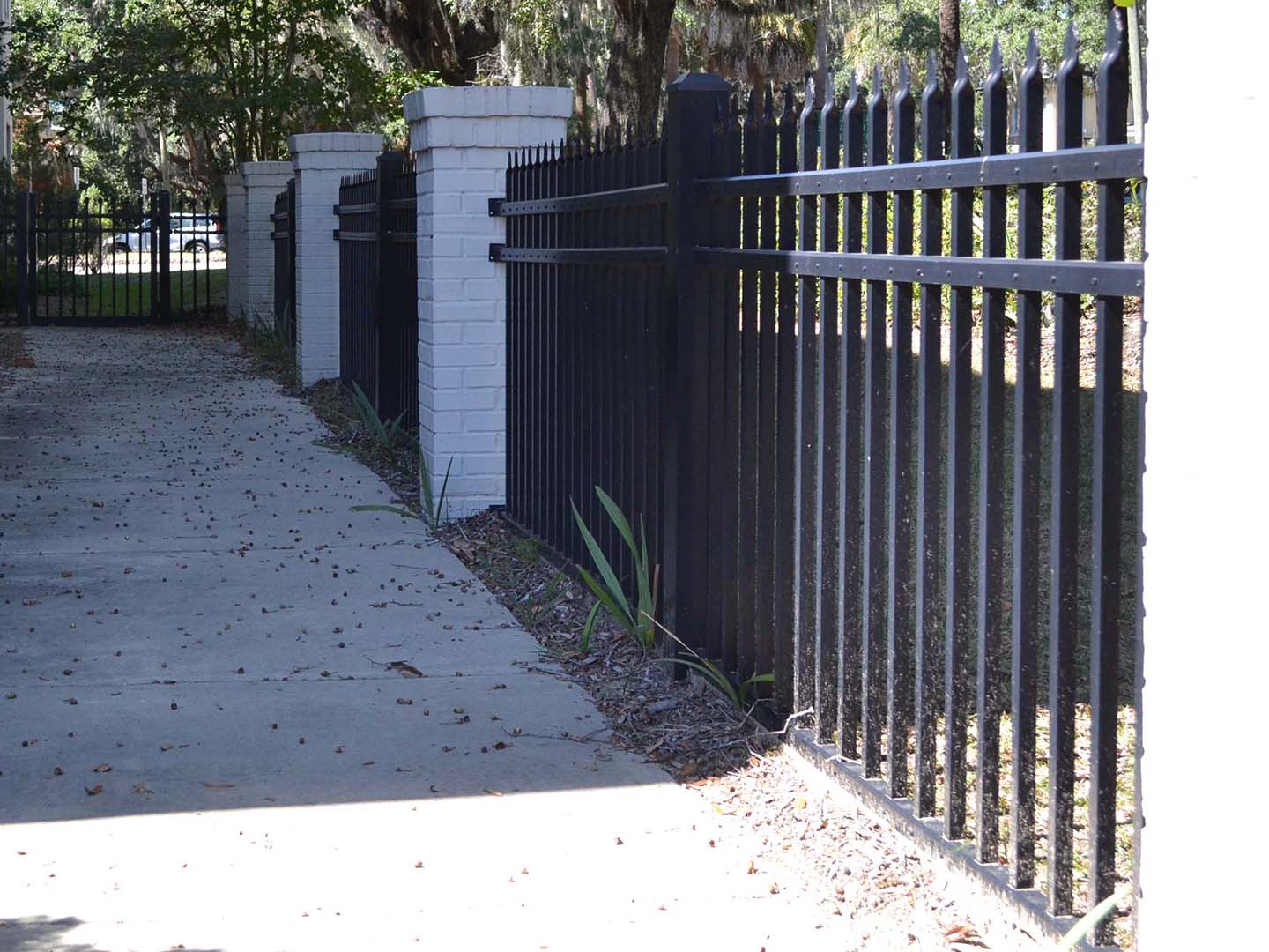 Commercial Black Aluminum Fence with Stone Columns - Fence Company in Georgia